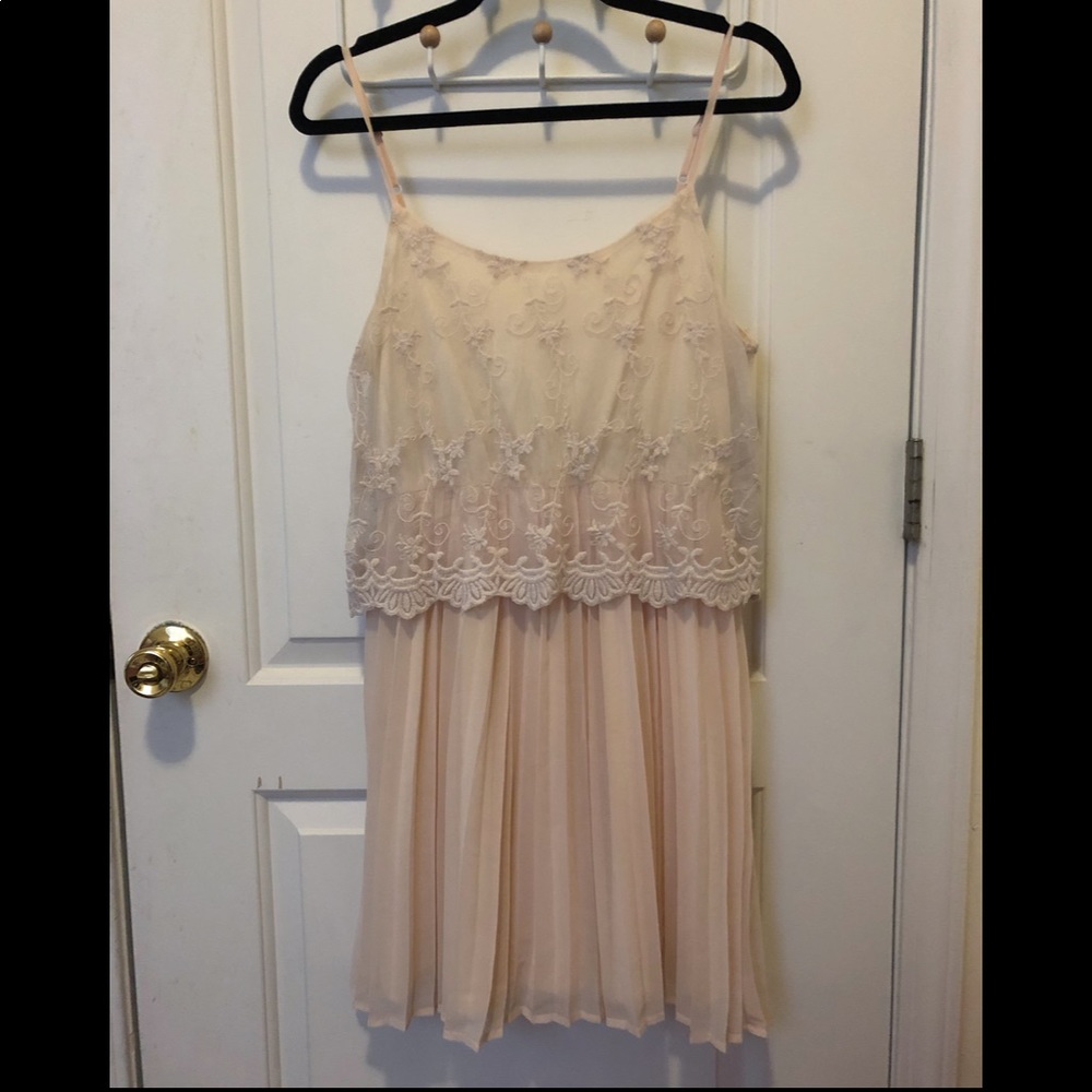 Lace blush mini dress with pleated skirt
